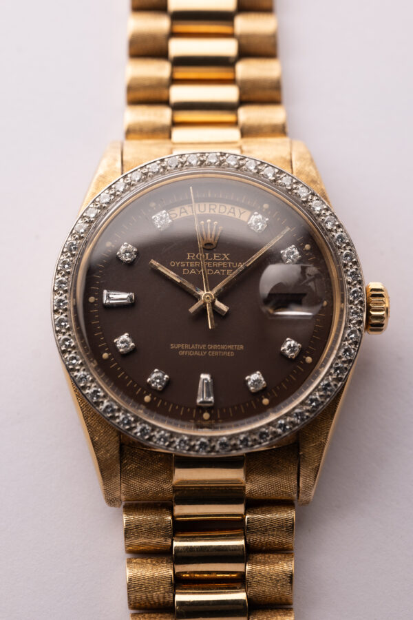 1972 Rolex 1803 Oxblood Diamond Dial w/ Florentine finish and Factory Diamond Bezel.