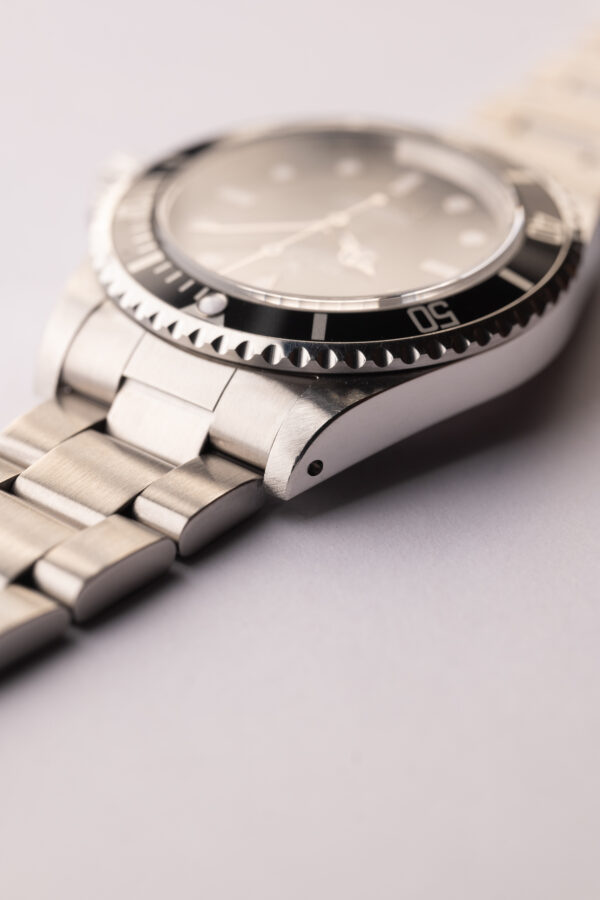 1997 Rolex 14060 Submariner W/Tag & Paper