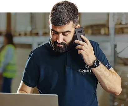 Man taking phone call using laptop