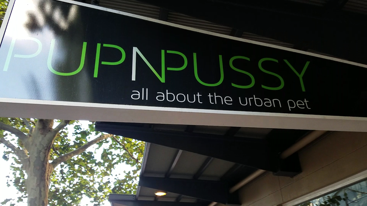 Sign for Pupnussy salon with tagline 'all about the urban pet'.