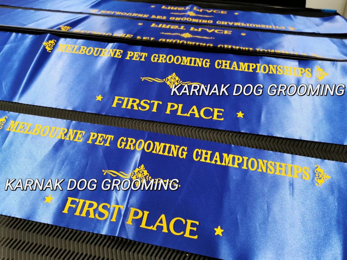 Blue ribbon with 'Melbourne Pet Grooming Championships' and 'Karnak Dog Grooming First Place' text.
