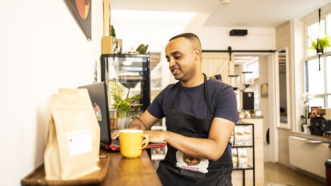 Dawit_Abraham_working_in_his_coffee_company.original