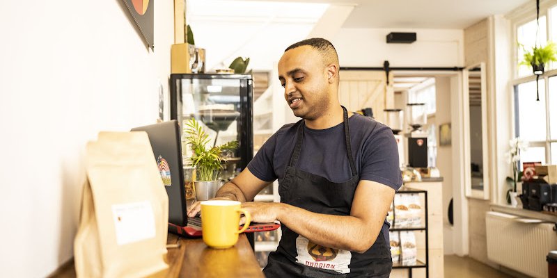 Dawit_Abraham_working_in_his_coffee_company.original