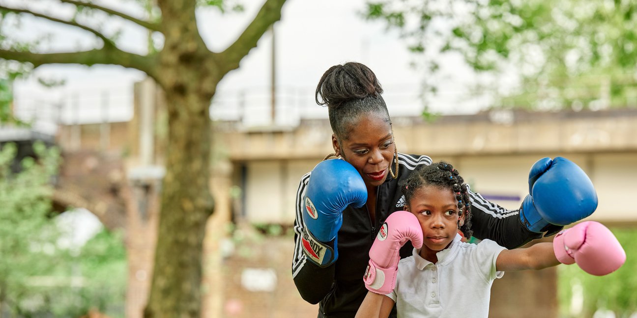 Women-teaching-child-to-box