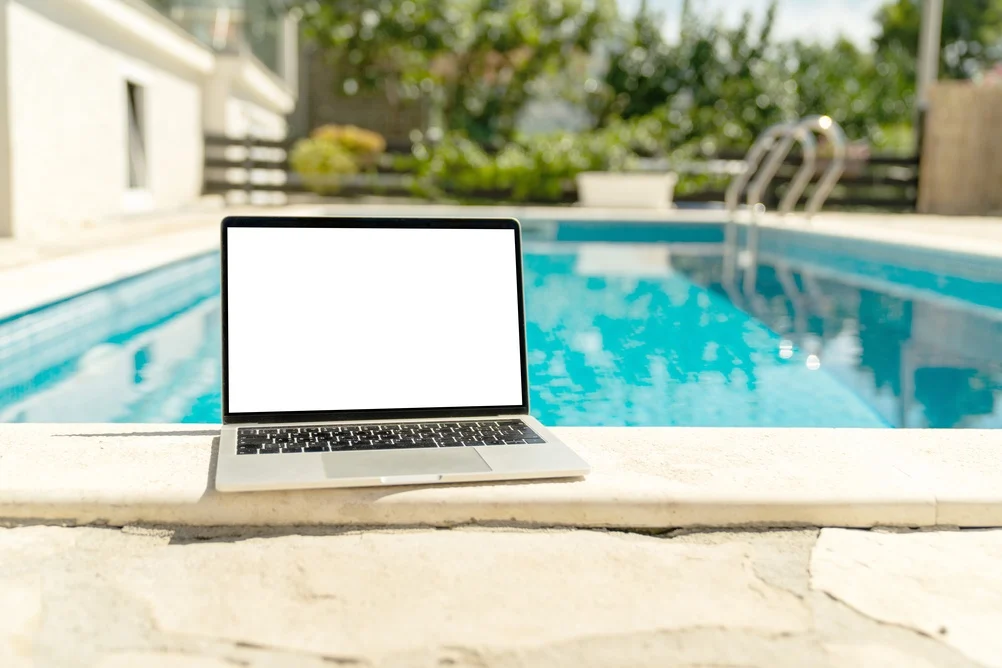 laptop by the pool