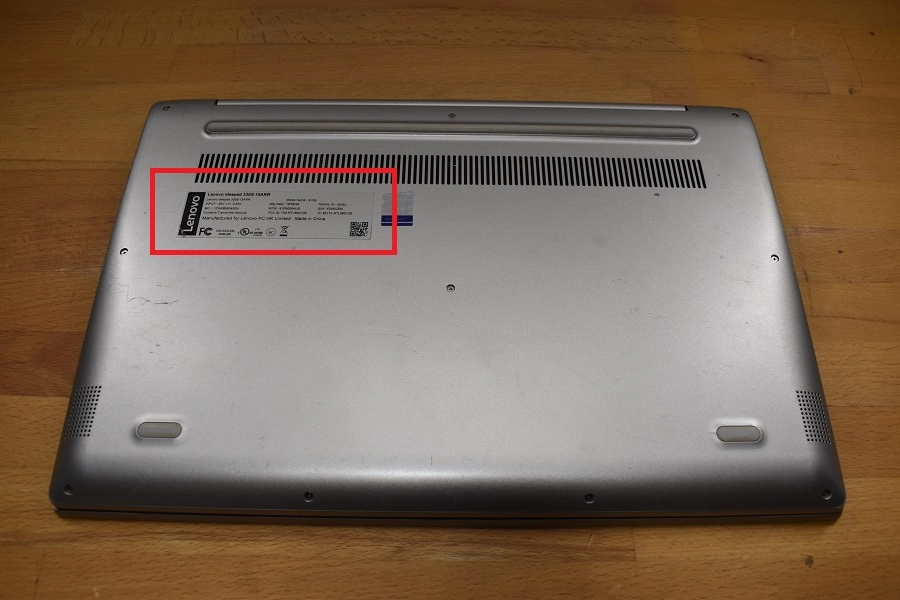 Underside of a Lenovo laptop showing the model number label