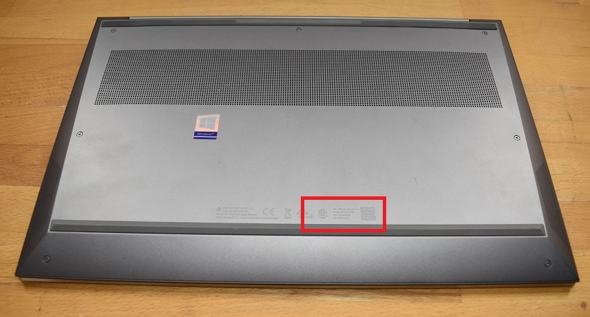 Underside of an HP laptop showing the model number label