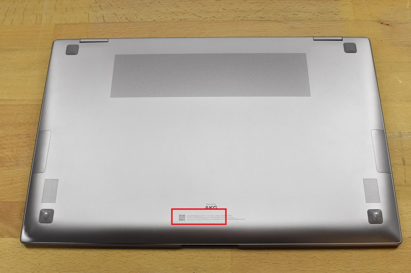 Underside of a Samsung laptop showing the model number label
