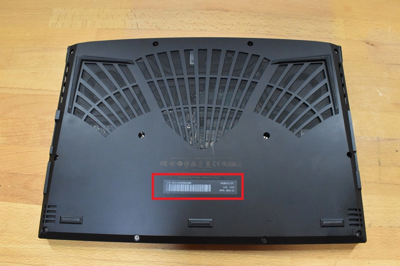 Underside of an Aorus laptop showing the model number label