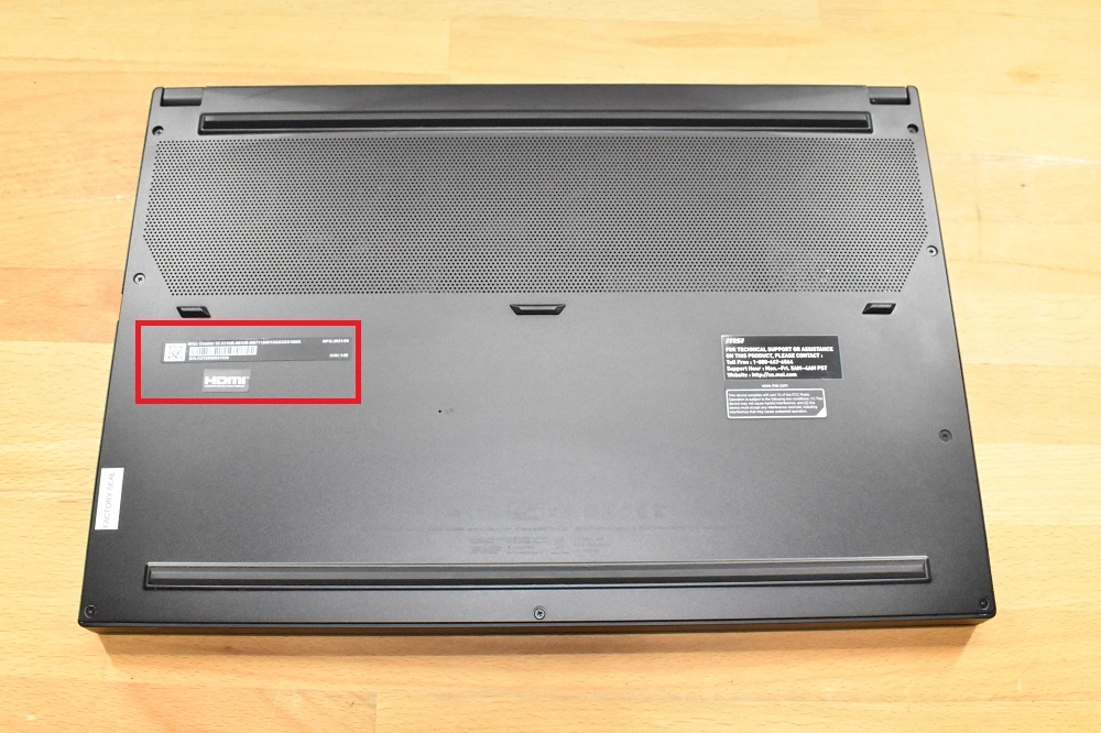 Bottom case of an MSI laptop showing the model number label