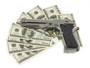 Handgun and 100 dollar bills