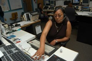 A dispatcher takes an emergency call