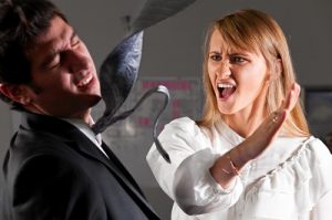 Woman slaps a man in an office