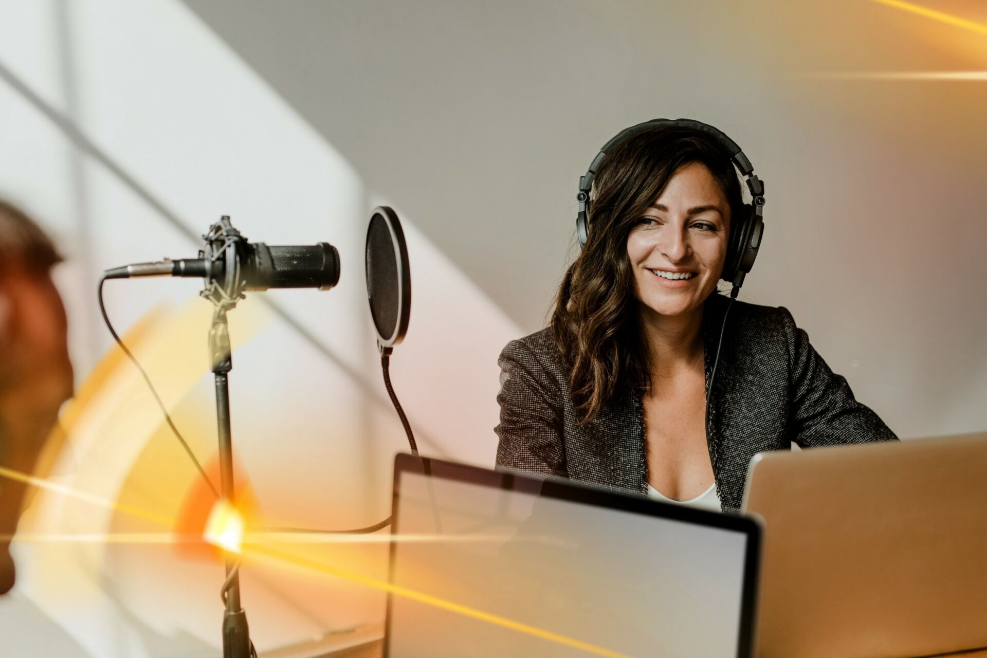 Female broadcaster interviewing her guest in a studio Insurance for Broadcasters