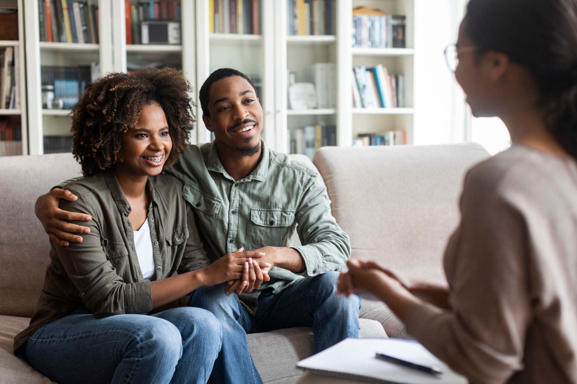 Happy black couple sitting in counselor office, successful marital therapy Insurance for Marriage and Family Therapists