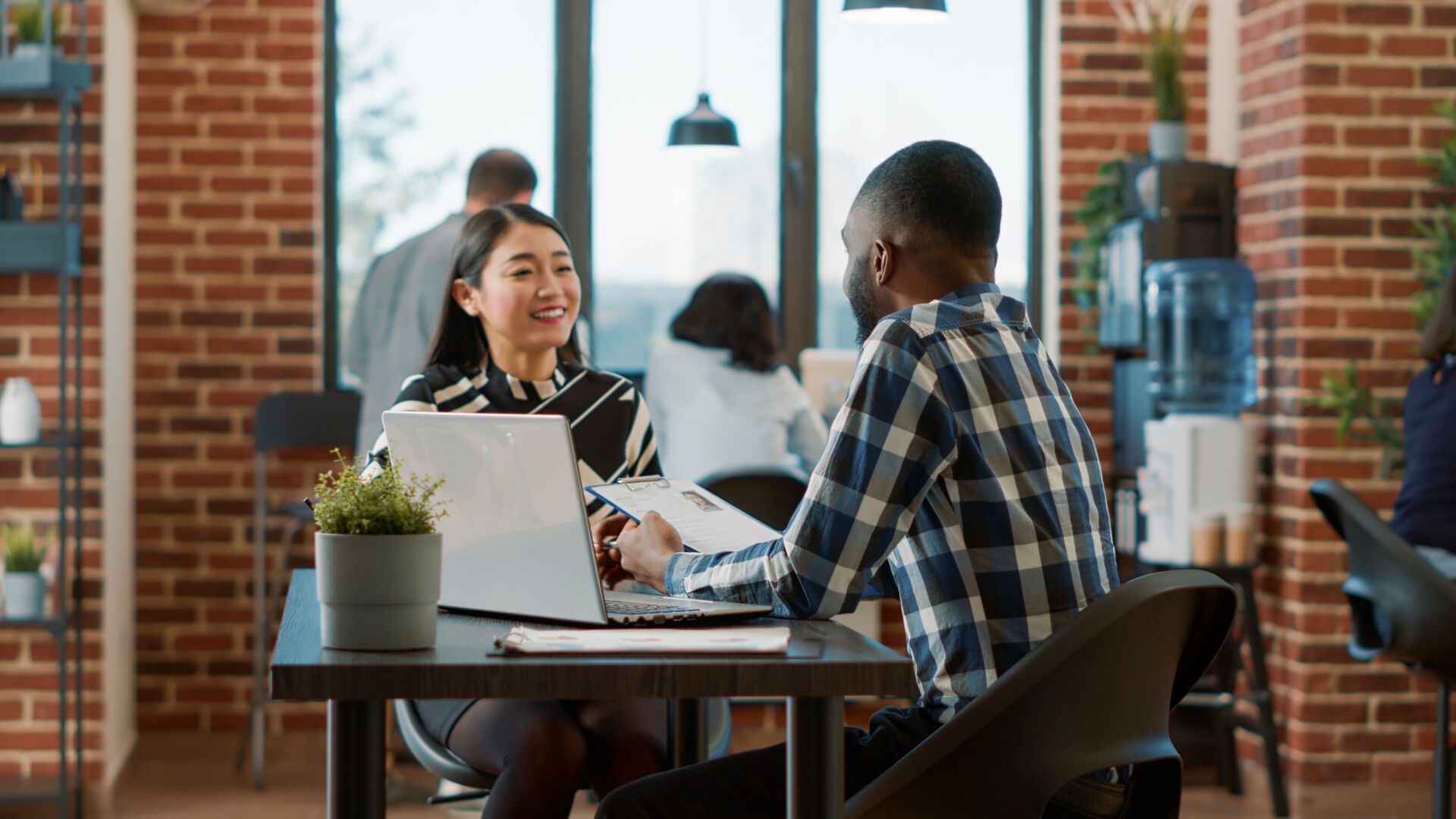 African american recruiter greeting asian woman at job interview Insurance for Recruitment Agencies