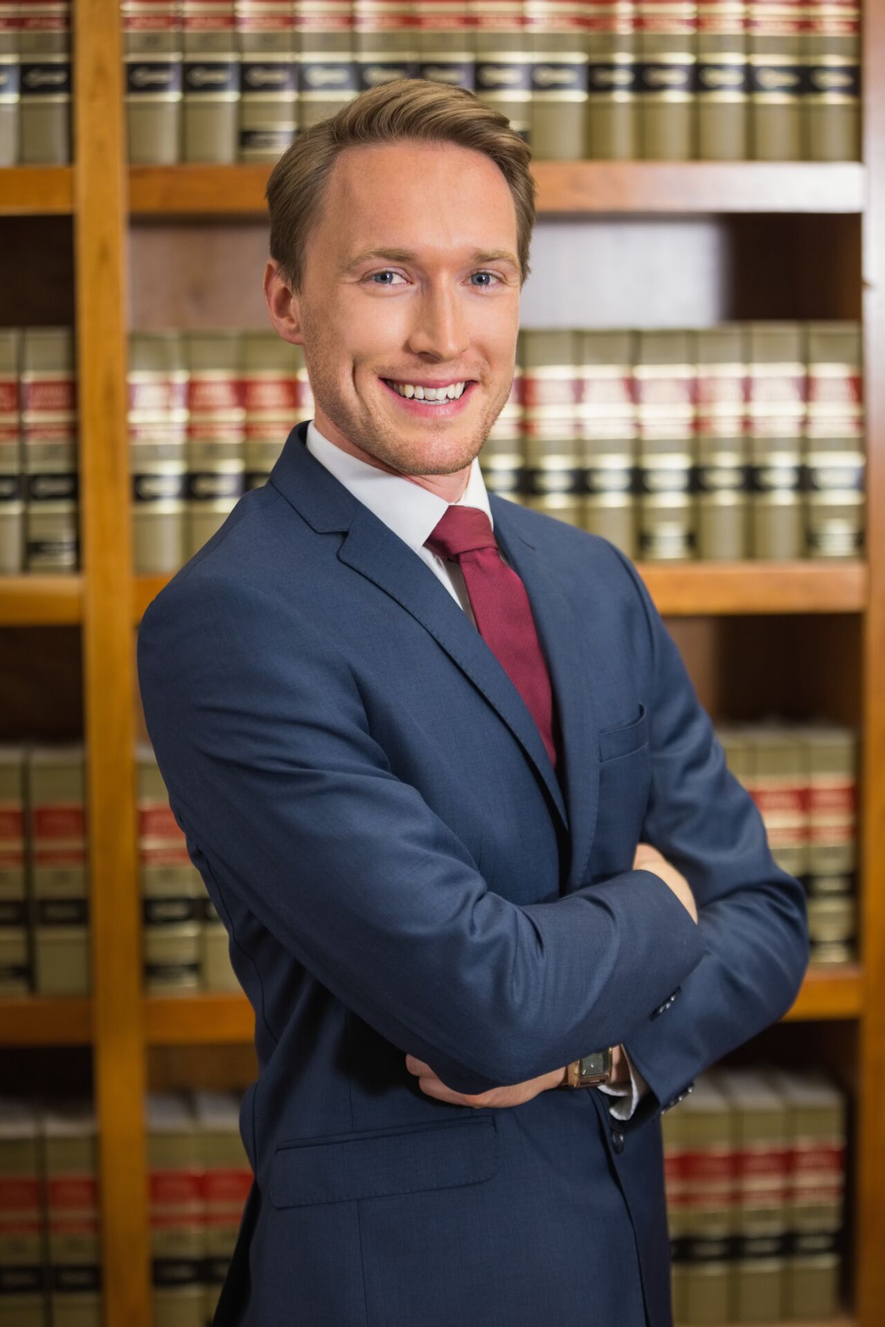 Lawyer smiling in the law library Insurance for Lawyers