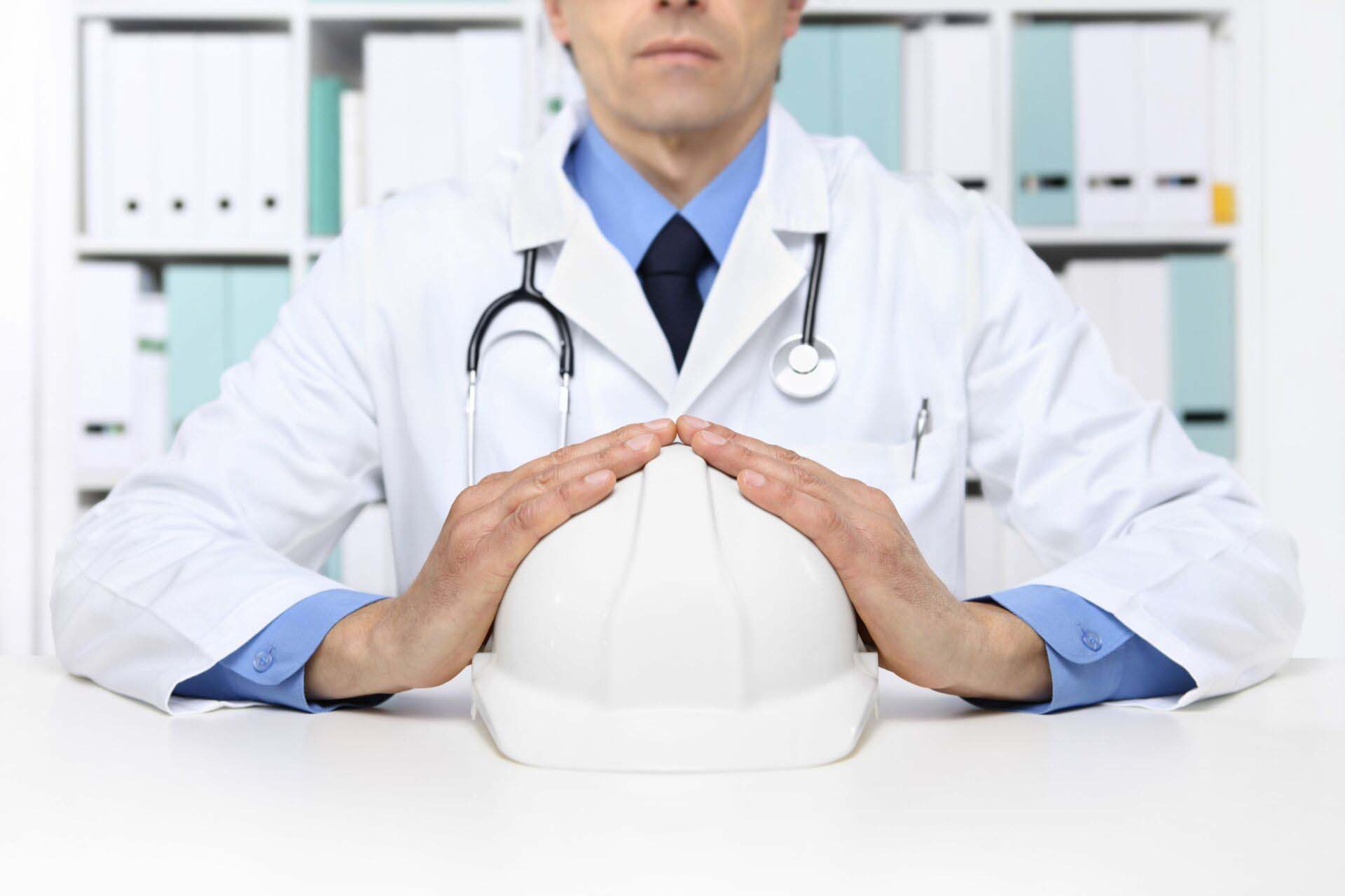 hands doctor protect helmet worker, medical health insurance concept Medical Malpractice Insurance