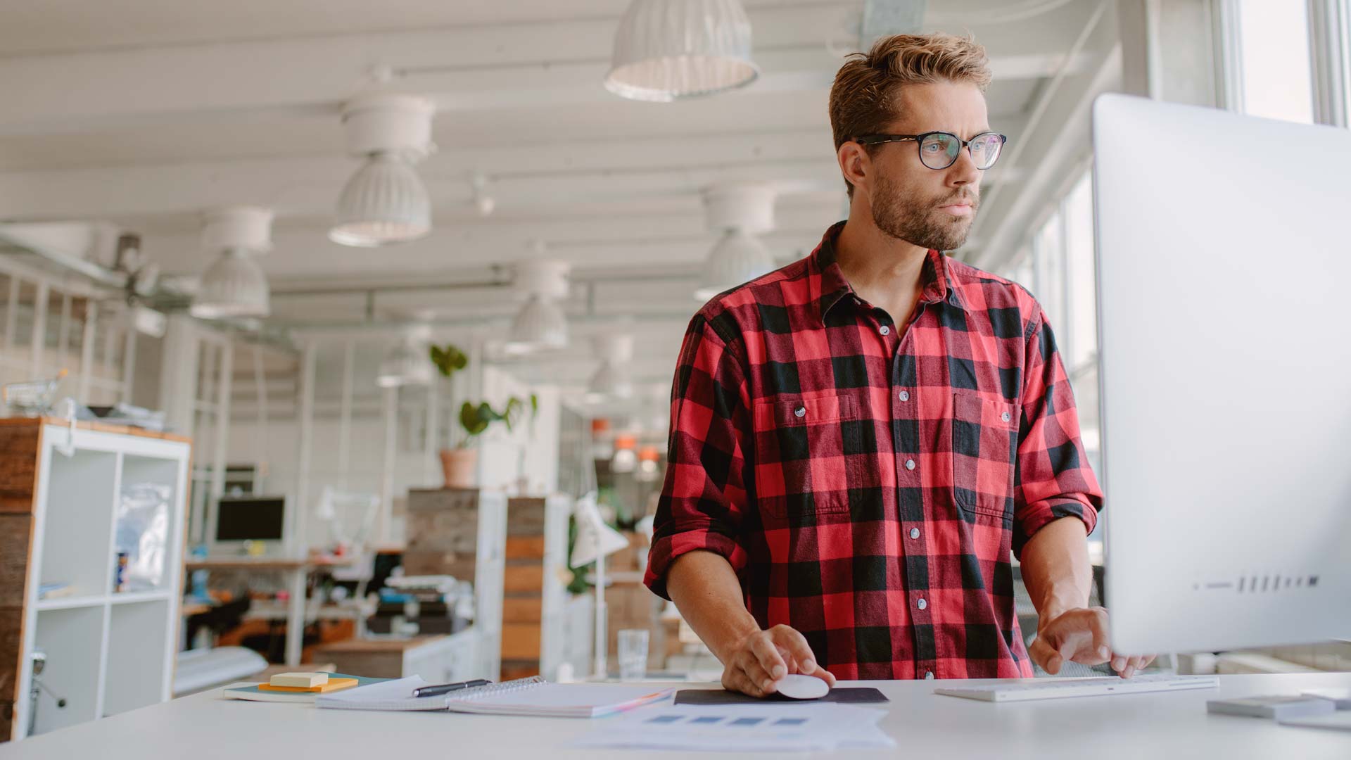 Man on computer with professional liability and general liability for small business in Pennsylvania Loss Control Insurance
