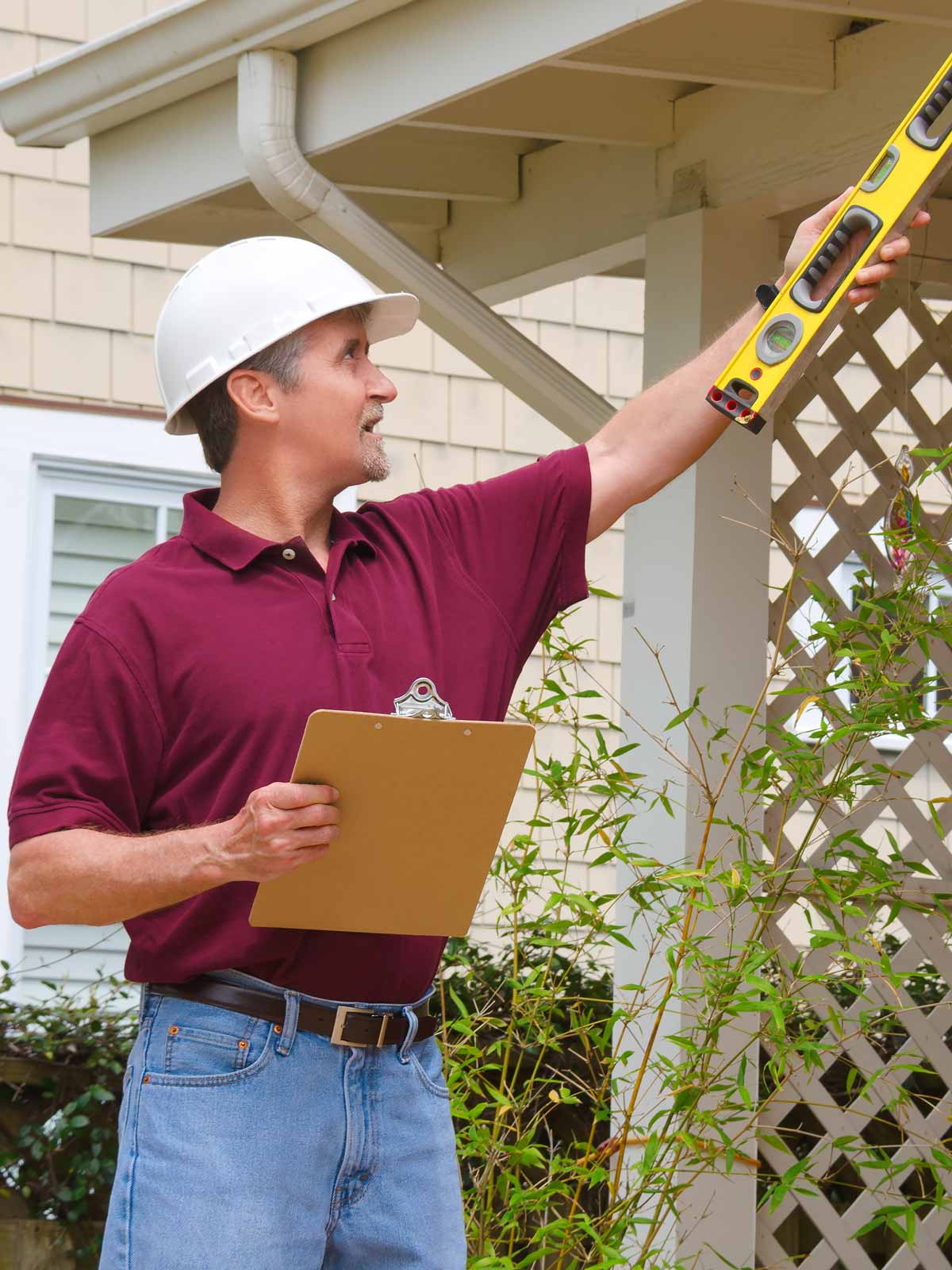 Contractor inspecting home protected with General Liability insurance in Pennsylvania Handyman Insurance