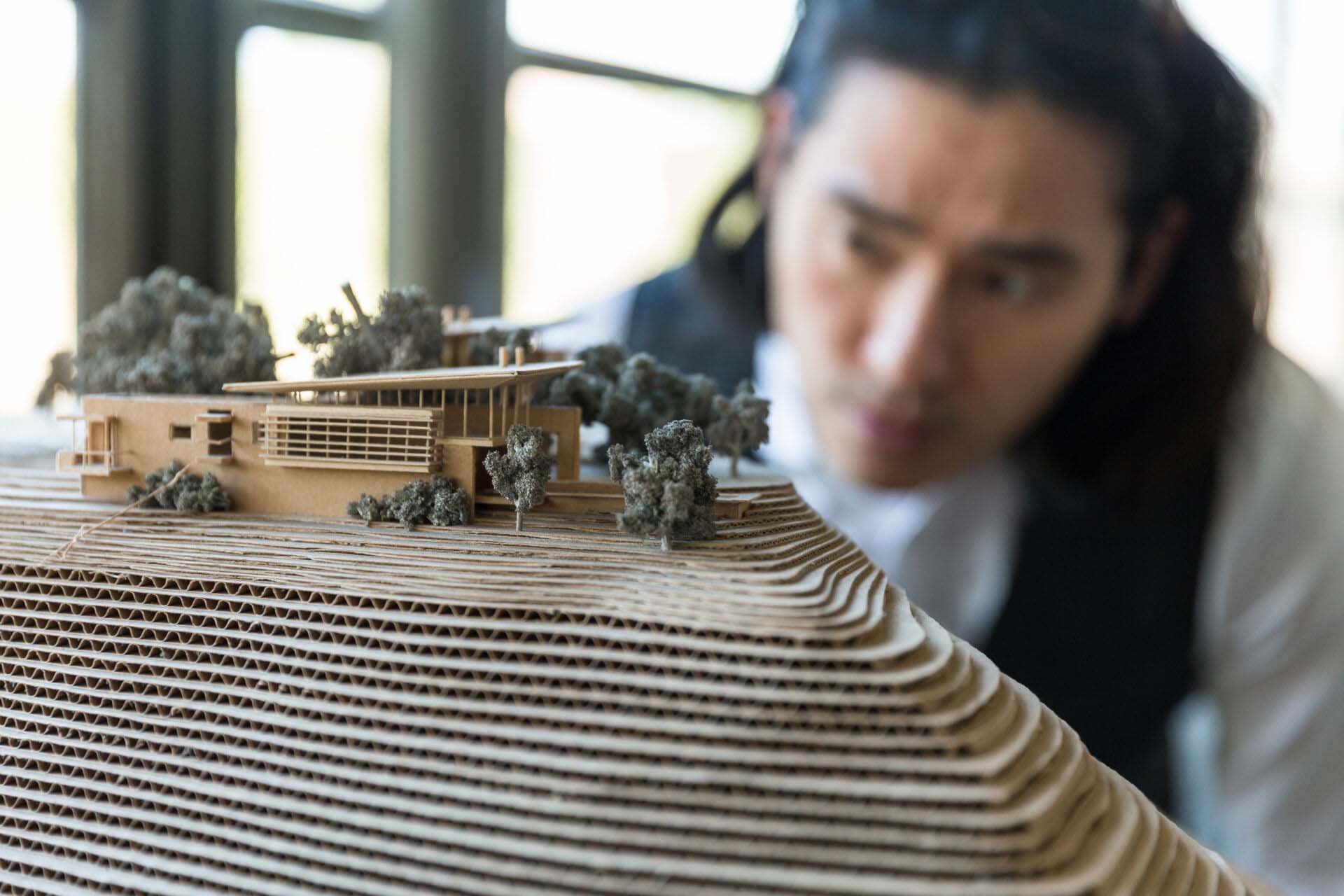 Close up architectural model of residential building and landscape terrain topography design Insurance for Landscape Architects