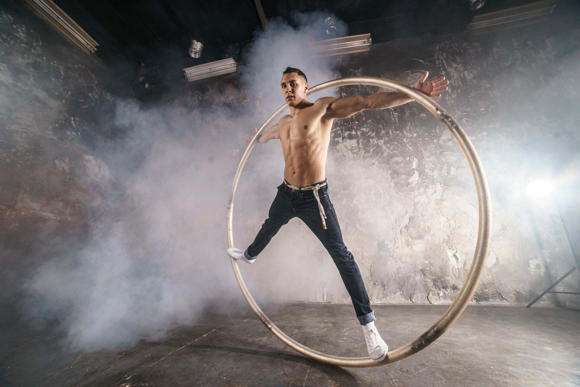Strong circus performer spinning a cyr wheel Insurance for Performers and Entertainers