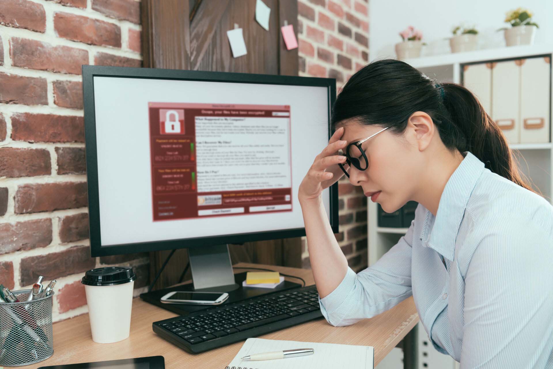 woman finding computer getting virus attack Cyber Liability Insurance