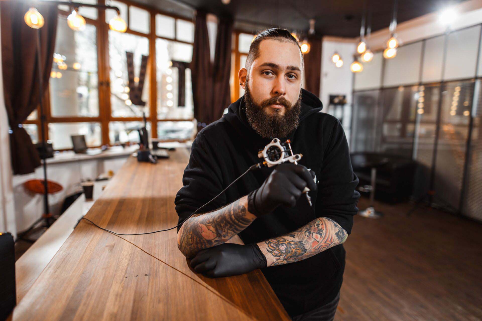 Portrait of professional creative tattoo master Insurance for Permanent Makeup Artists