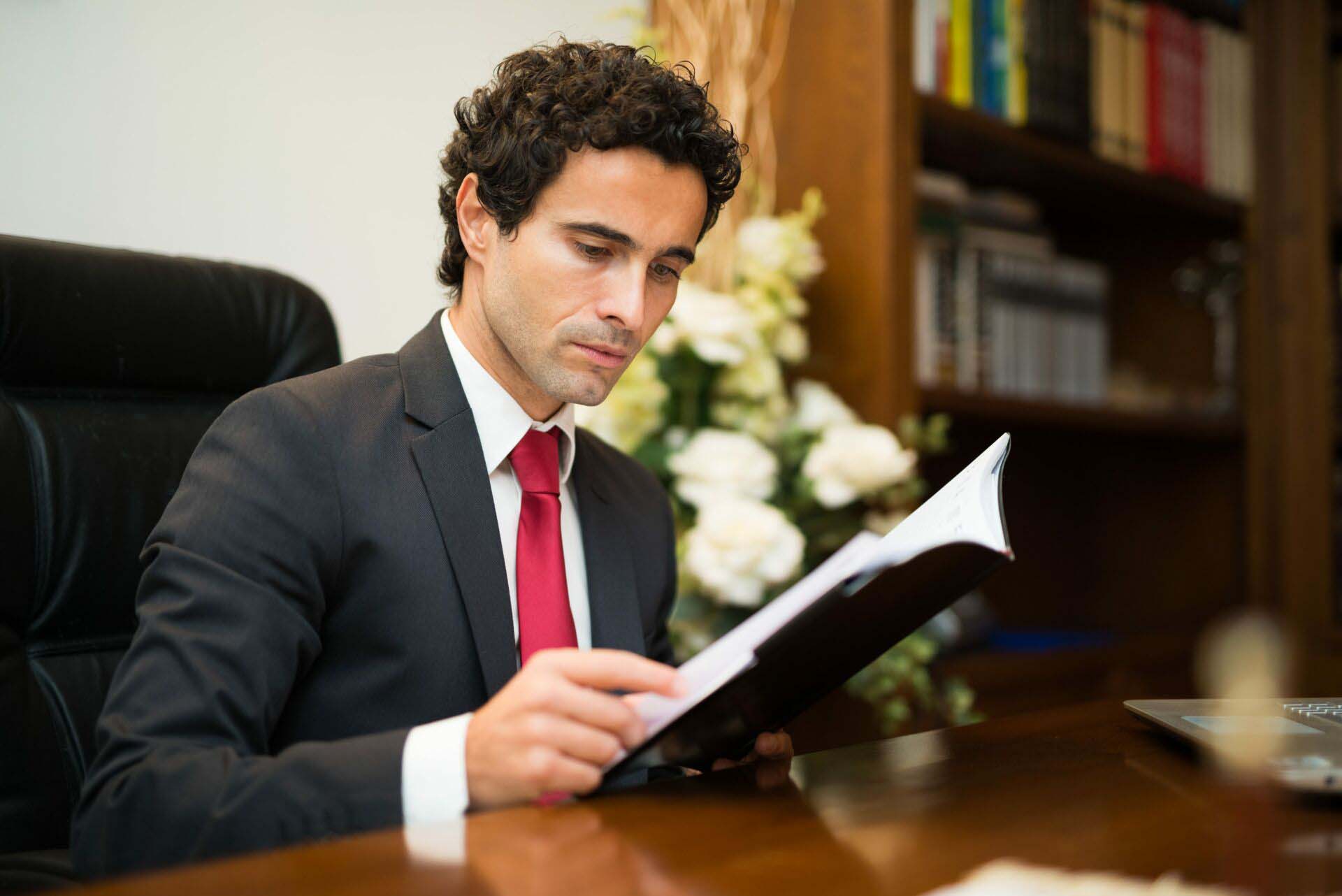 Businessman reading his agenda Insurance for Funeral Directors