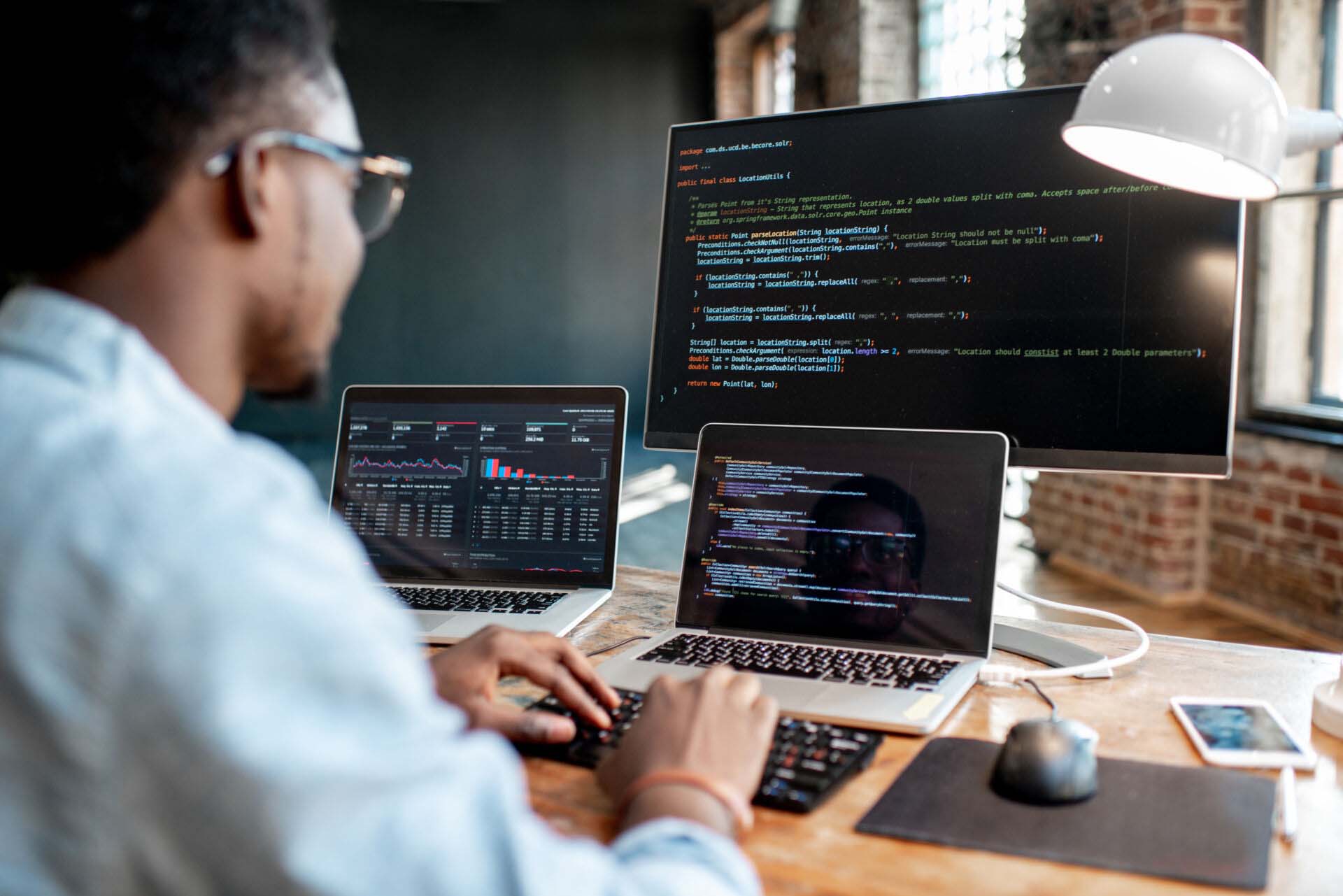 Programmer working with program code Insurance for Web Developers