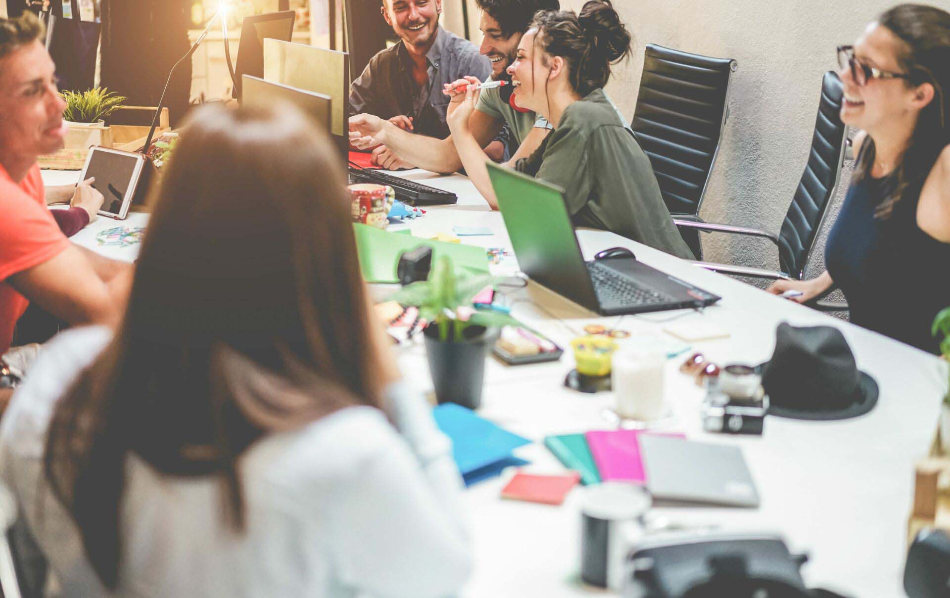 Young co-workers team talking during startup – Happy people plan Insurance for PR Agencies