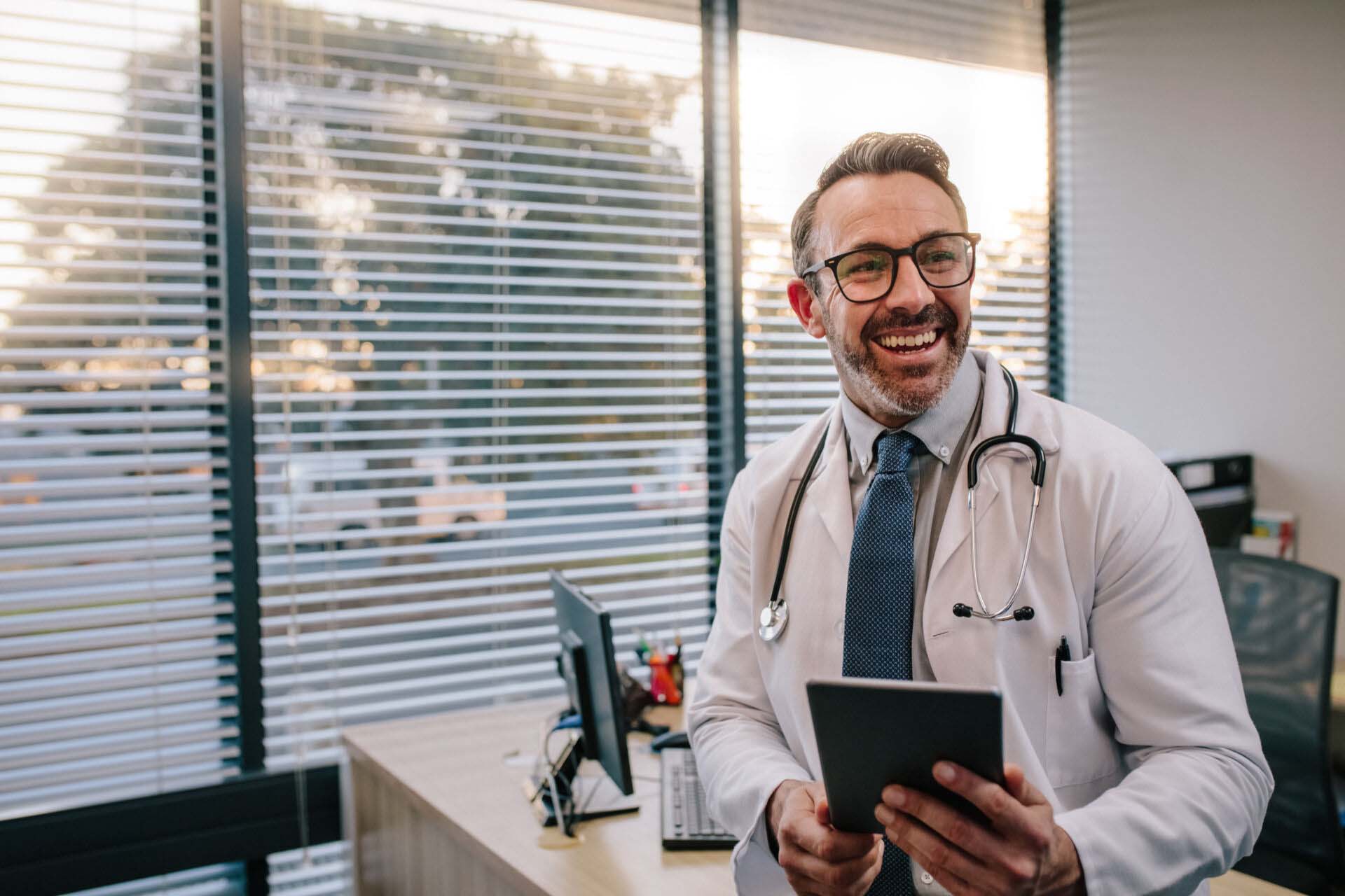 Doctor with digital tablet in his office Healthcare Professionals