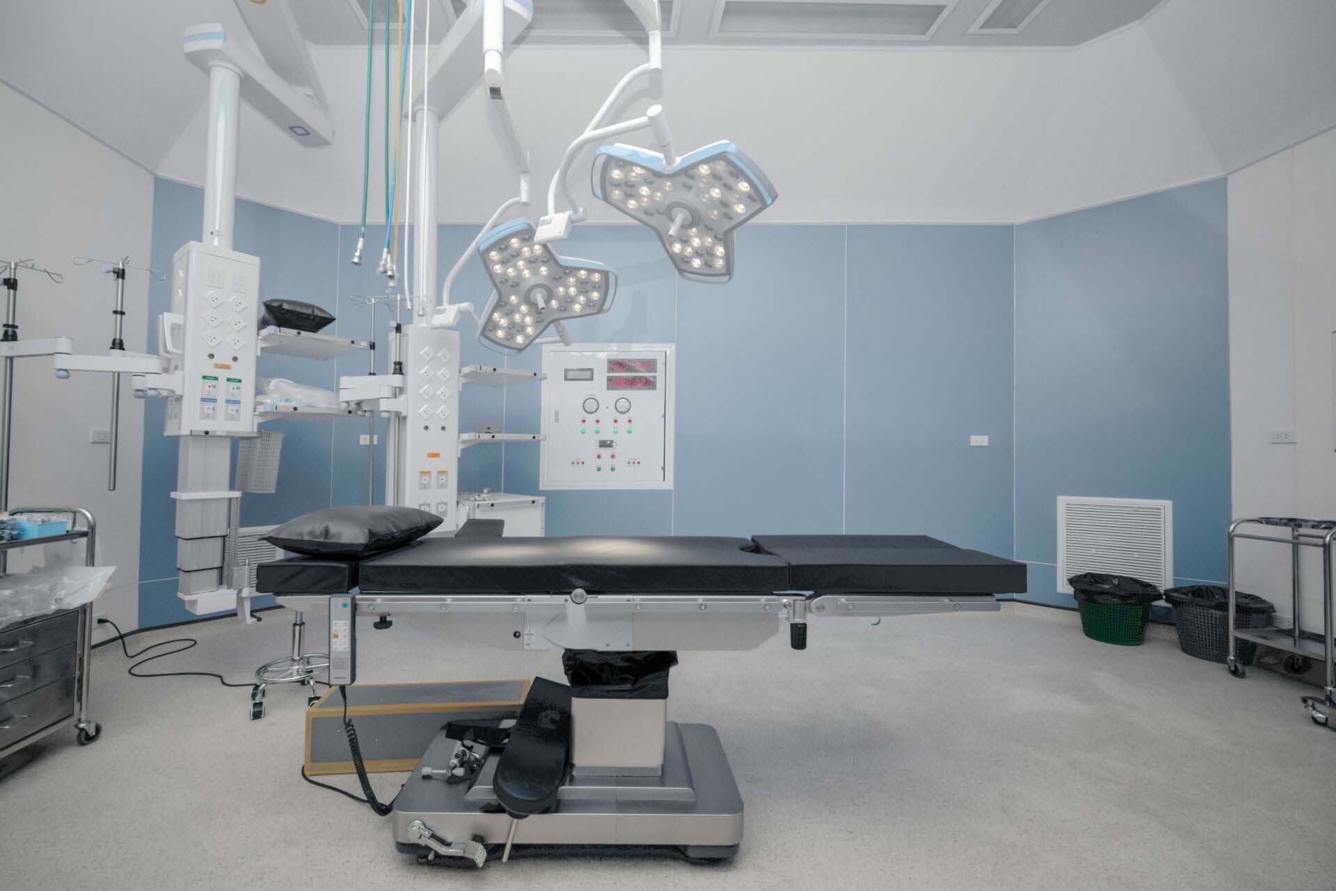 background of hospital empty operation room with surgery bed and surgery light Insurance for Ambulatory Surgery Centers