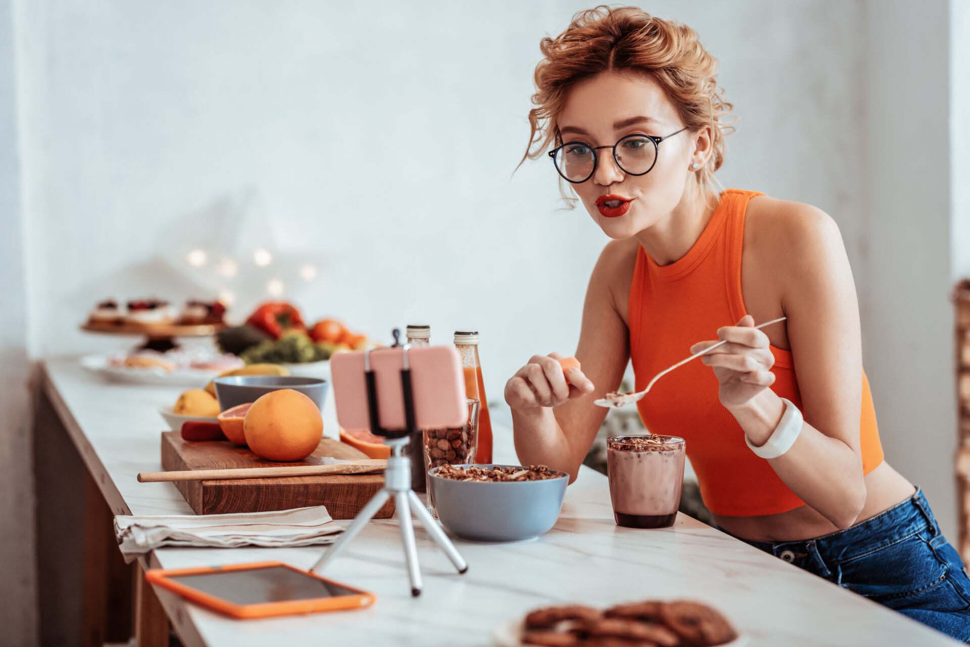 Nice pleasant woman pointing at the spoon Insurance for Influencers