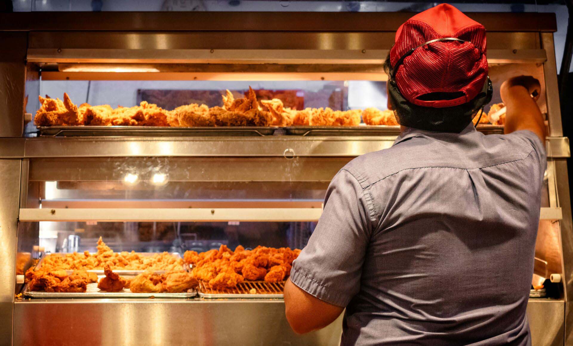 Minimum Wage Employee Works in a Fast Food Kitchen. Insurance for Fast Food Restaurants