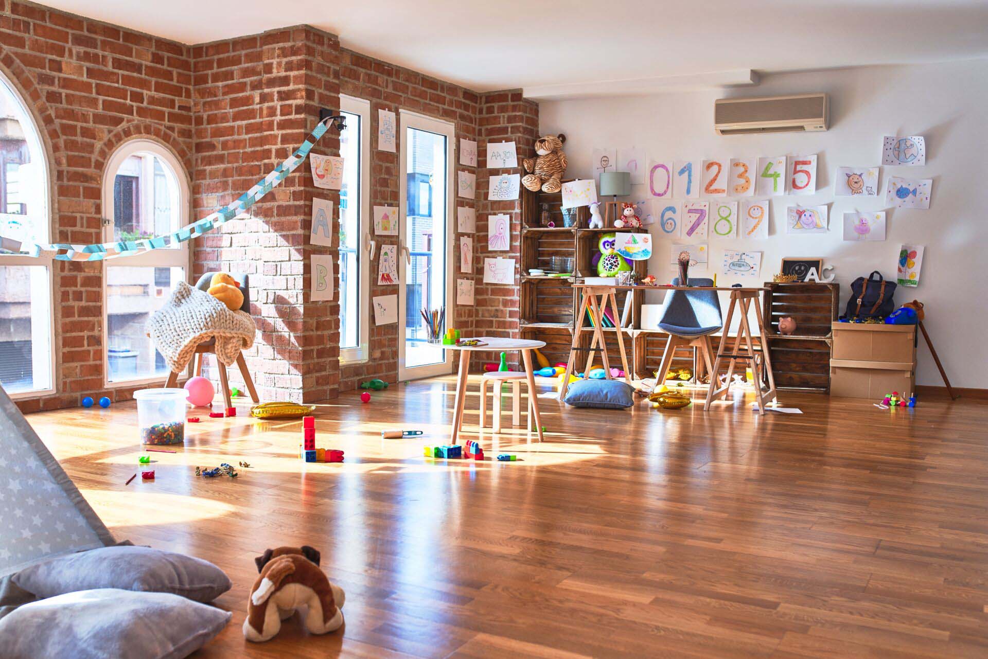 Picture of preschool playroom with colorful furniture and toys around empty kindergarten Insurance for Daycare Centers
