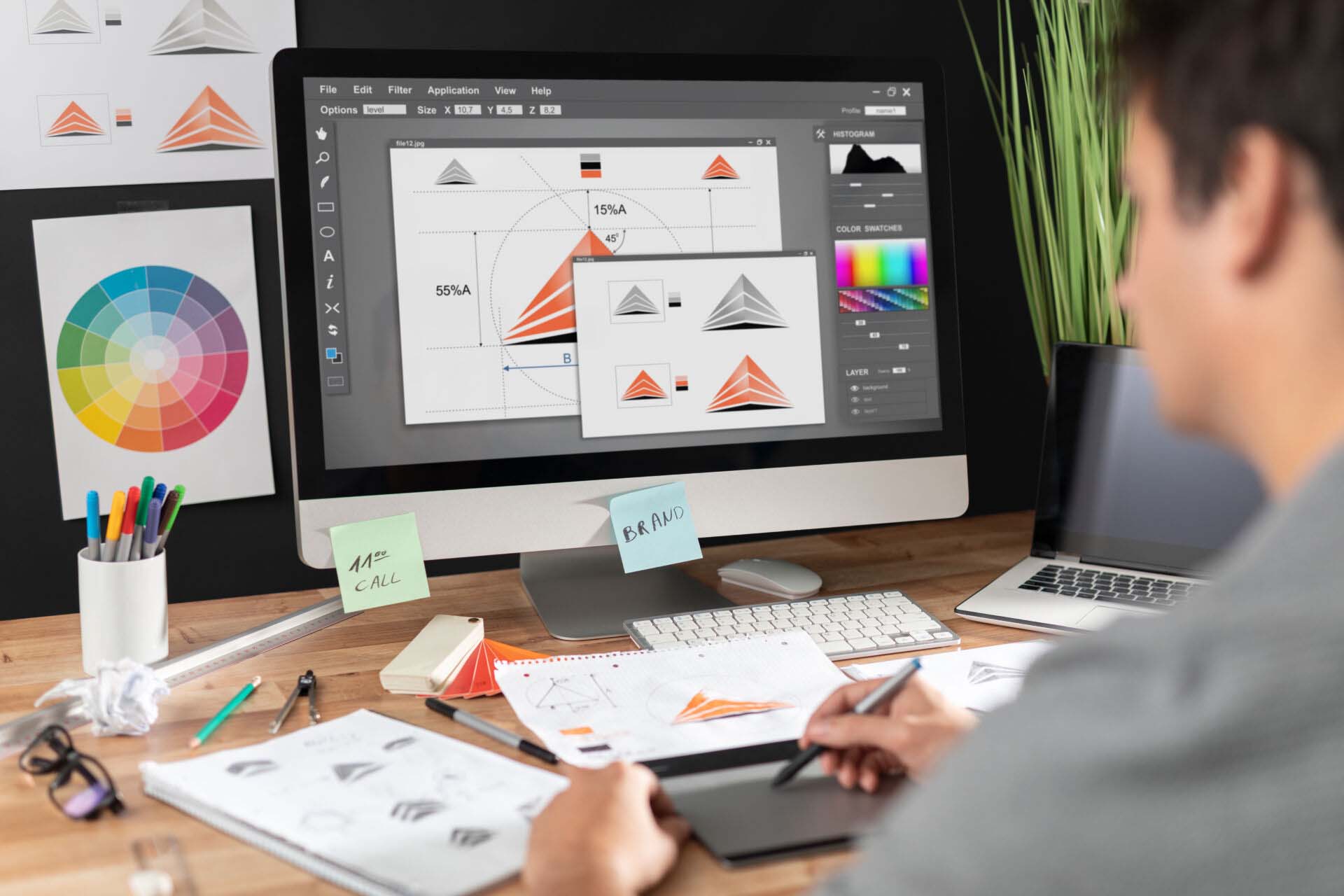 Graphic designer drawing sketches logo design. Insurance for Graphic Designers