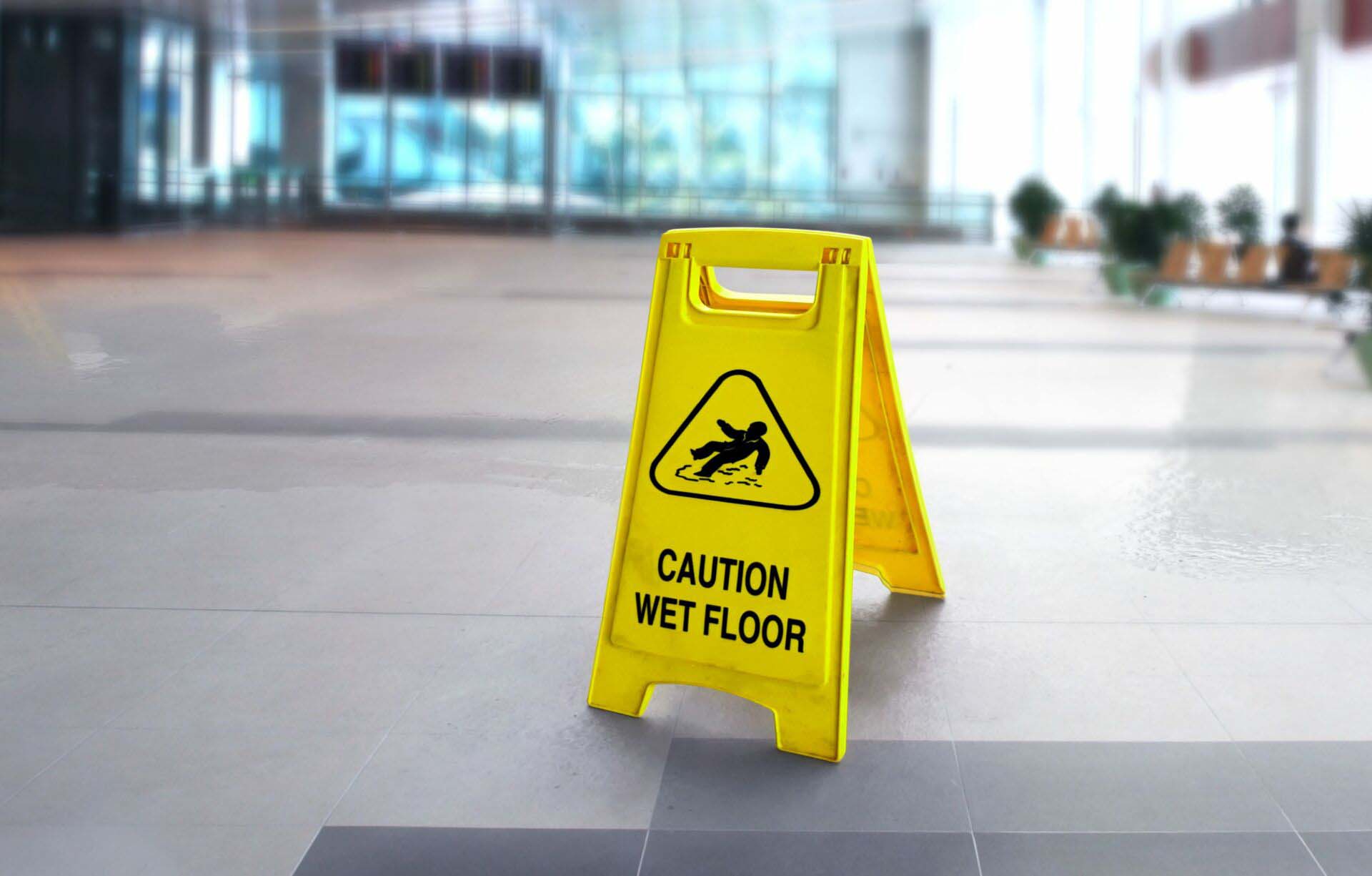 Caution wet slippery floor sign in the building General Liability