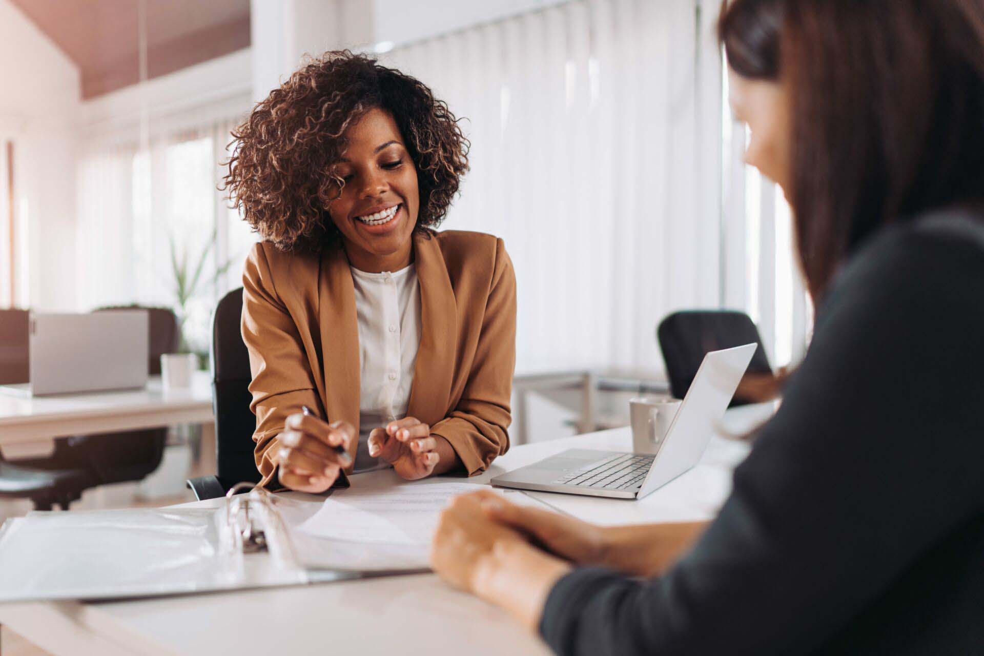 Client consulting with a agent Insurance for Title Abstractors