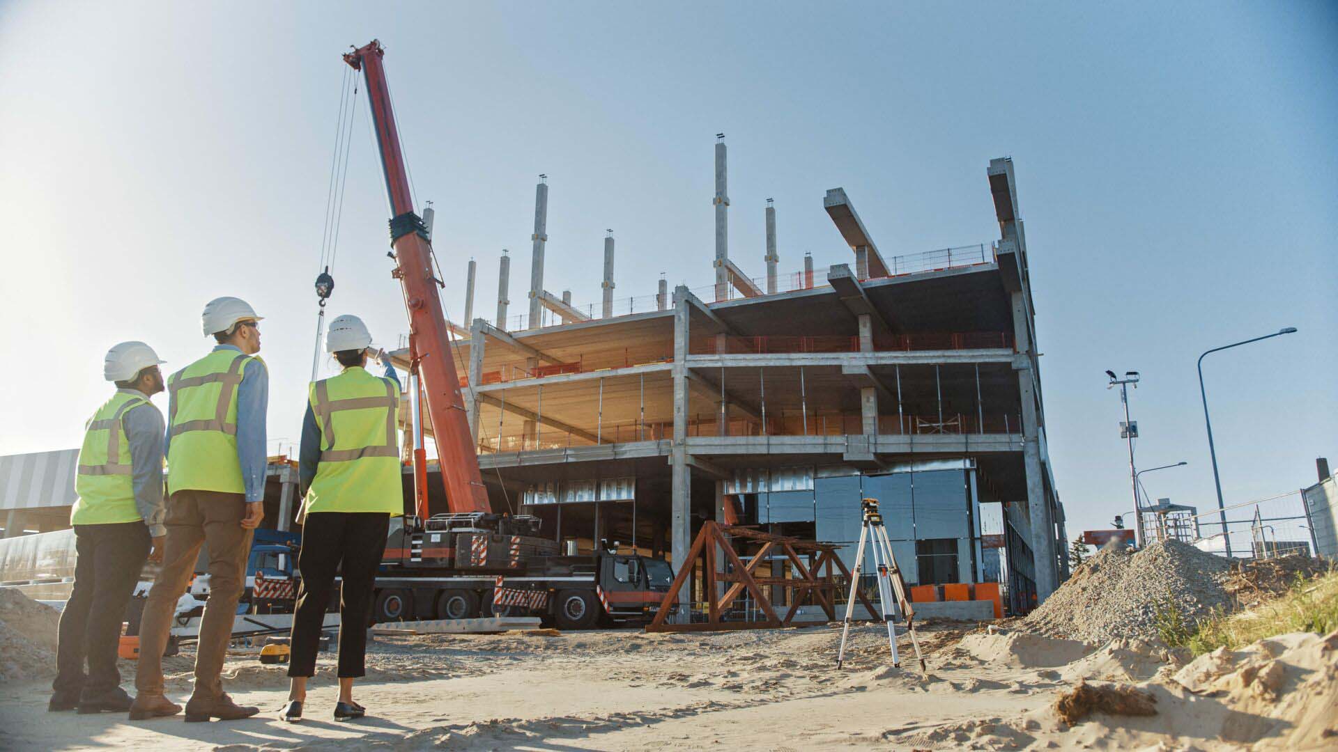 Diverse Team of Specialists Inspect Commercial, Industrial Build Insurance for Commercial Builders