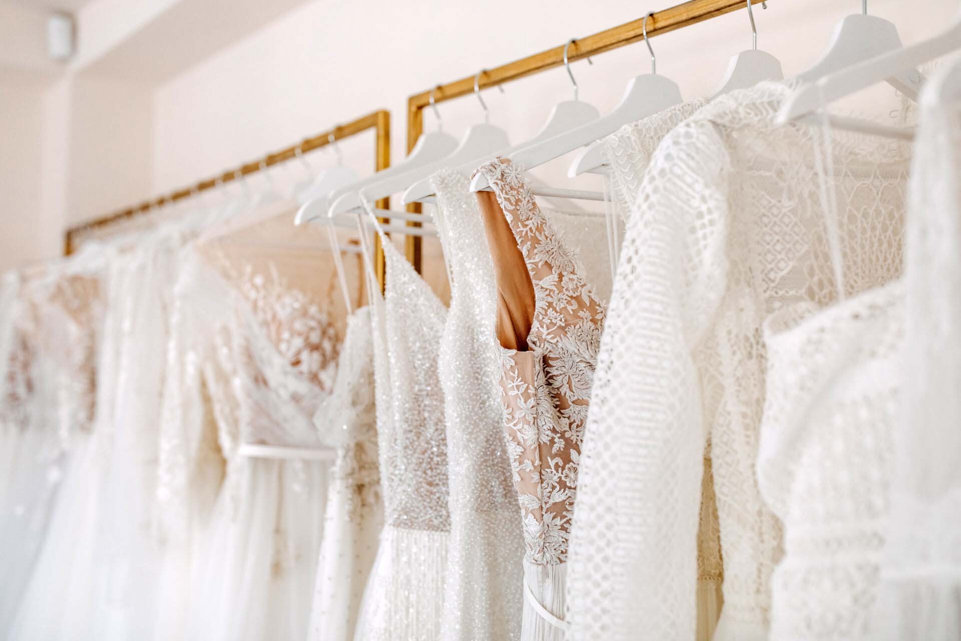 Bridal dresses collection at showroom. Luxury bridal gowns shop. Insurance for Bridal Shops