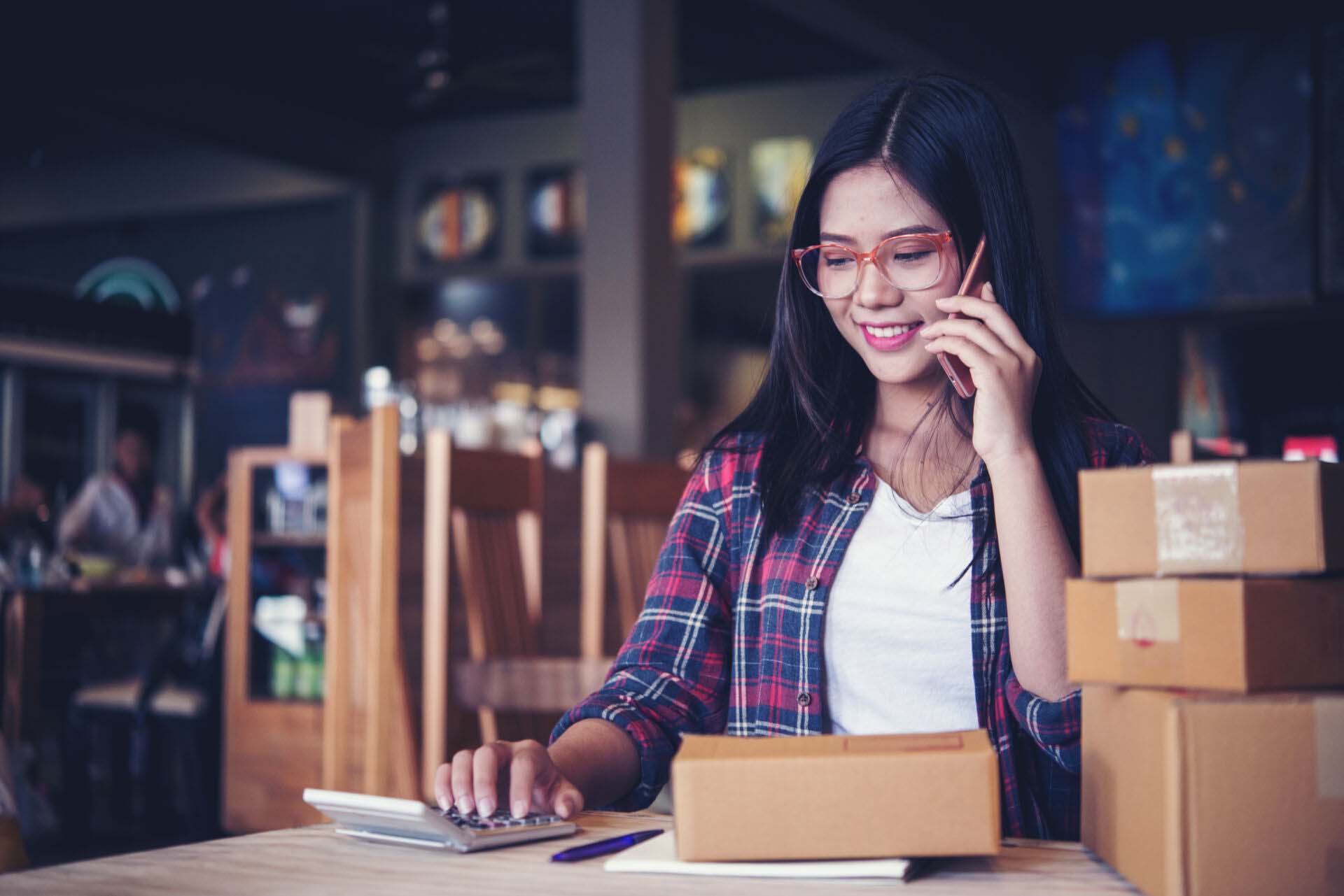 Young entrepreneur, teenager business owner work at home, box for delivery Insurance for Amazon Sellers
