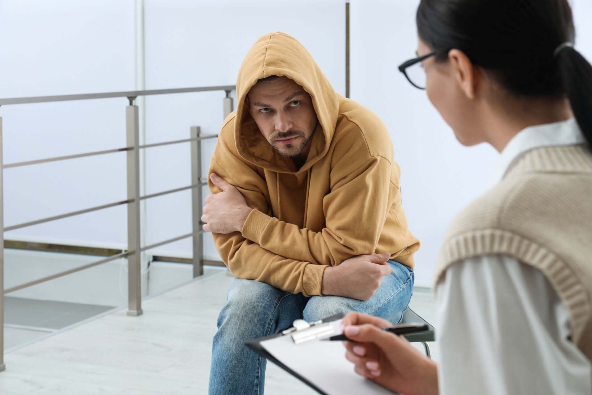 Psychotherapist working with drug addicted man indoors Insurance for Rehabilitation Counselors