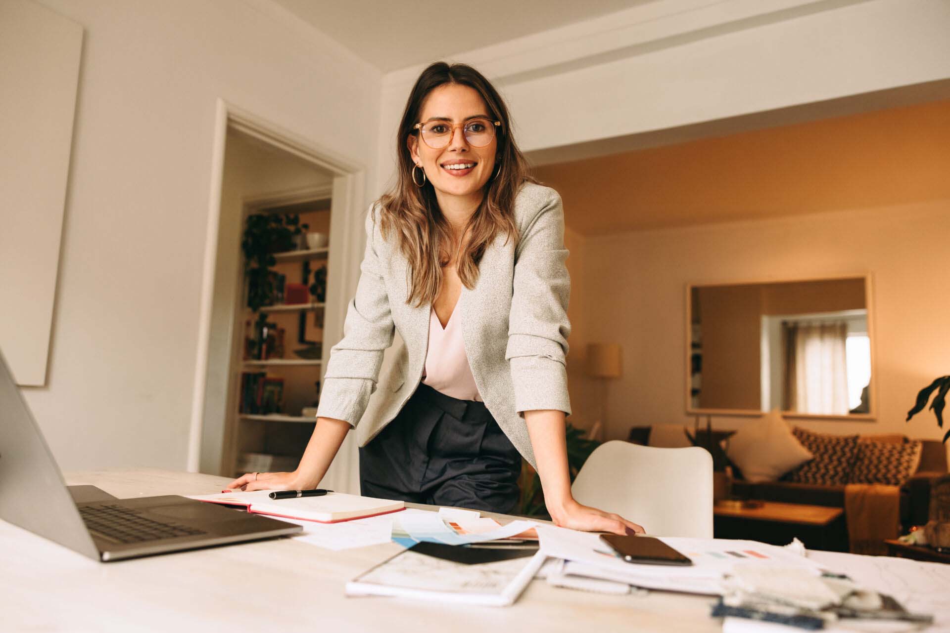 Interior designer working in her home office Insurance for Career Coaches