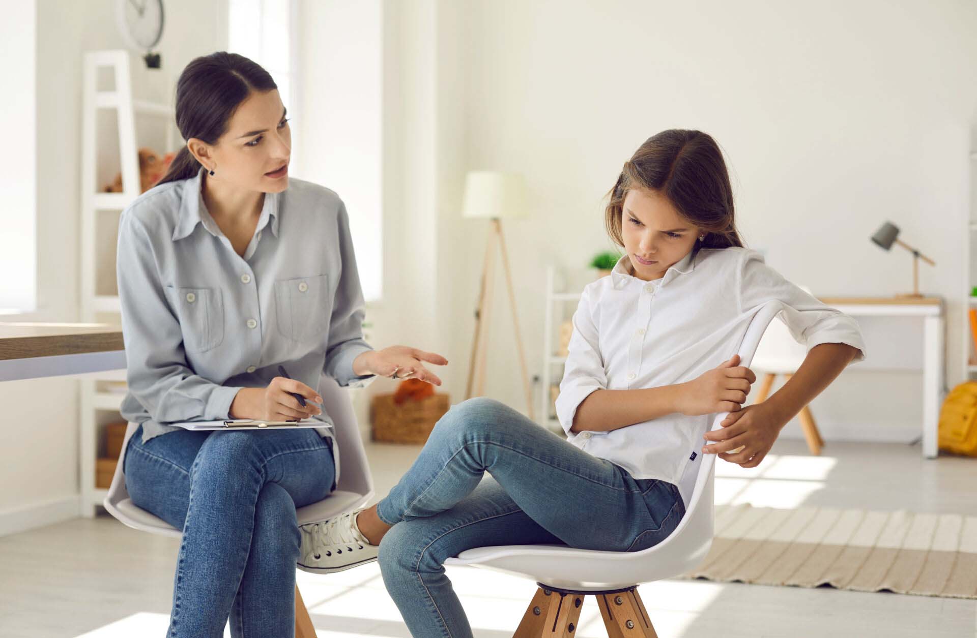 Female psychologist talk with teen girl suffer from bullying Insurance for Social Workers