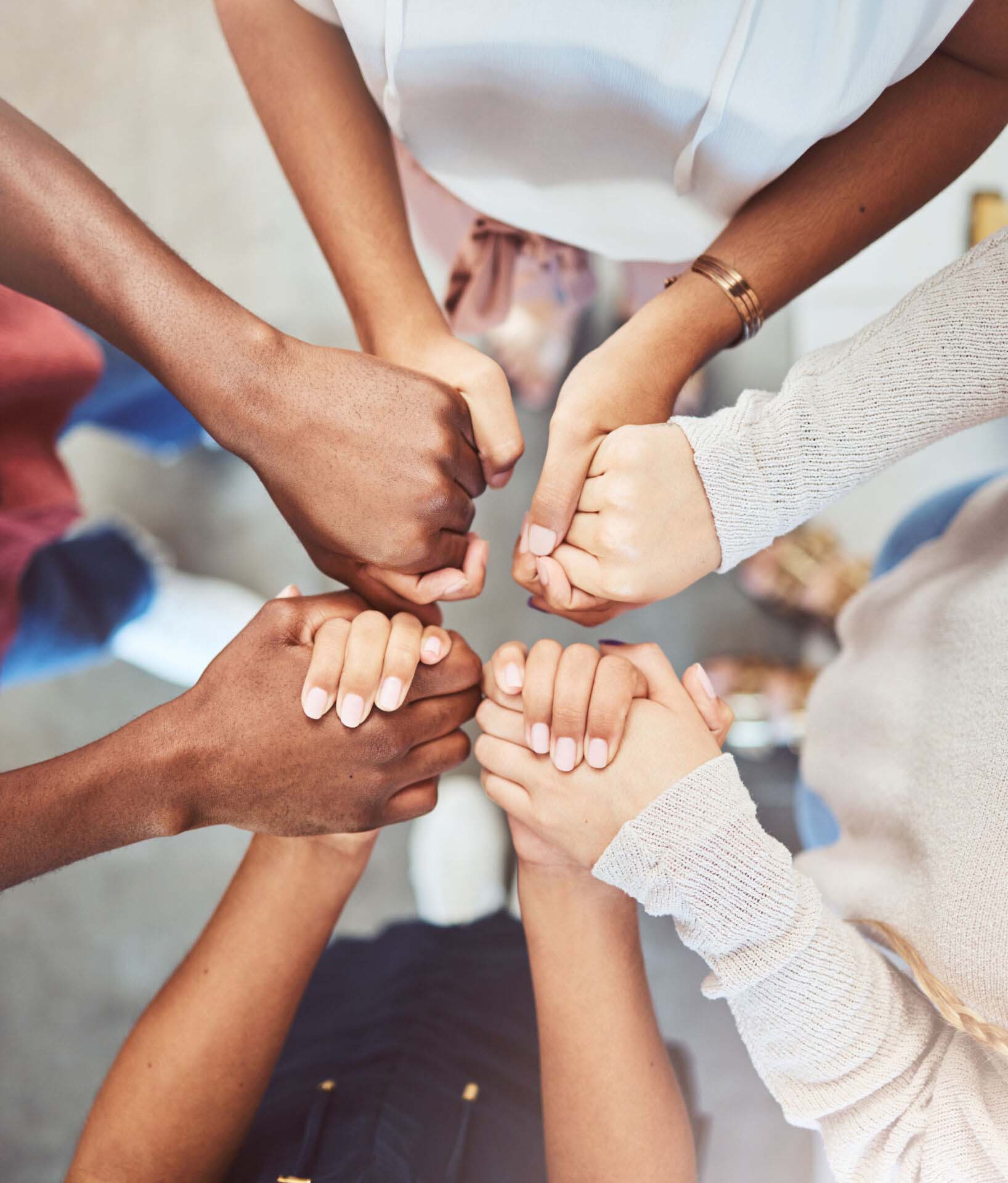 Support, prayer and trust with people holding hands in counseling for mental health, wellness or teamwork. Worship, hope and community group therapy for help, solidarity or spiritual faith from above Insurance for Faith-Based and Pastoral Counselors