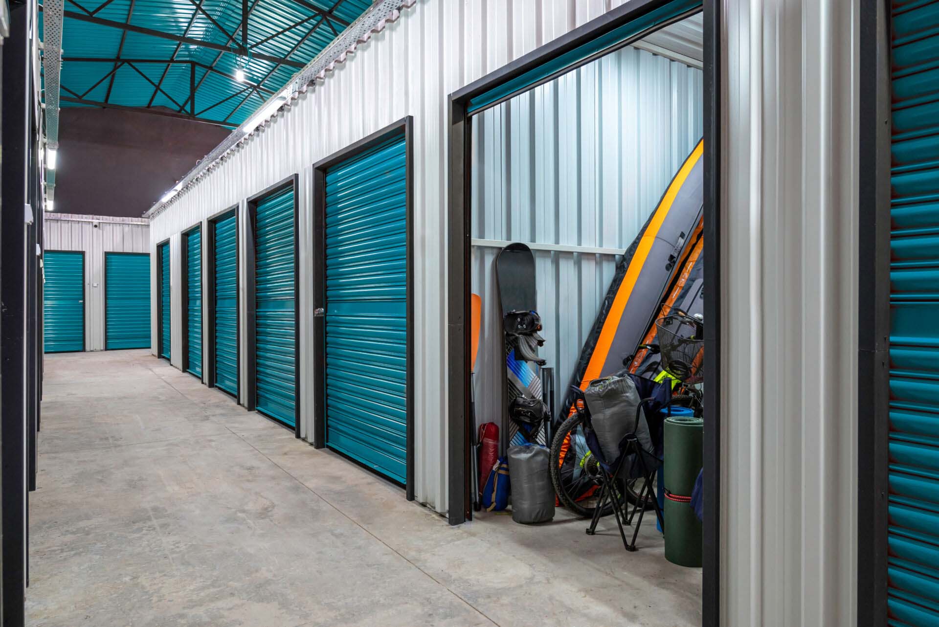 Outdoors activity items seen through the open door of the self storage unit. Rental Storage Units Insurance for Storage Facilities