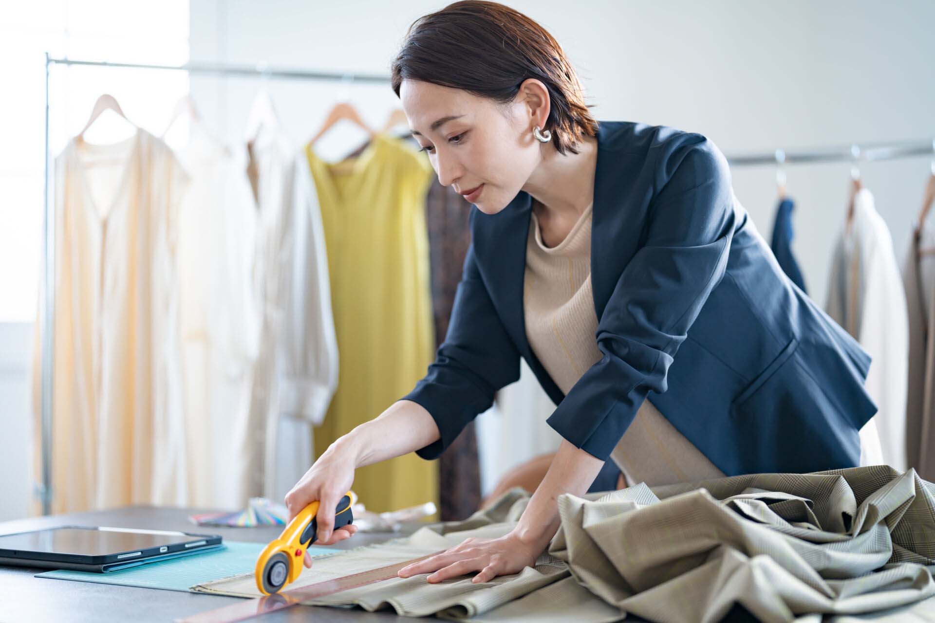 Woman business owner making dress Insurance for Clothing and Apparel Manufacturers