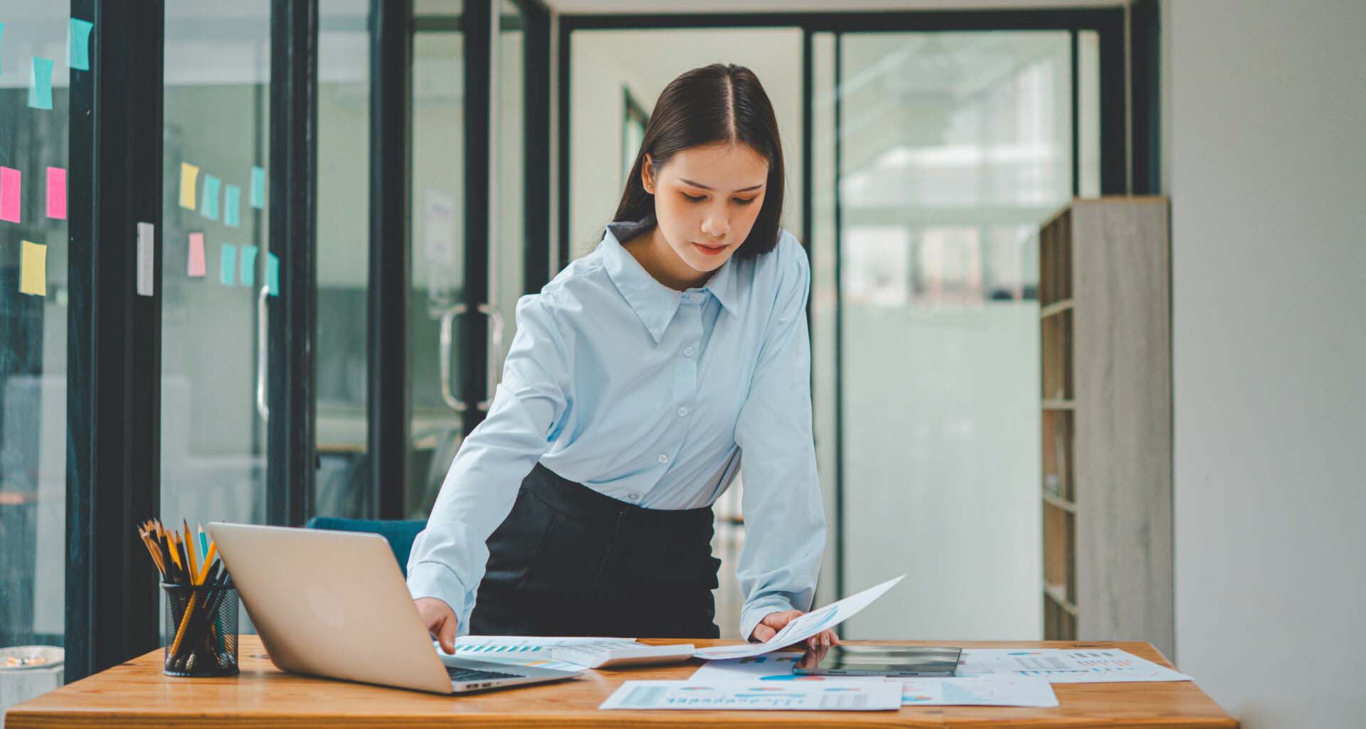 Asian business woman working using laptop for do math finance on wooden desk, tax, accounting, statistics and analytical research concept Insurance for Actuaries