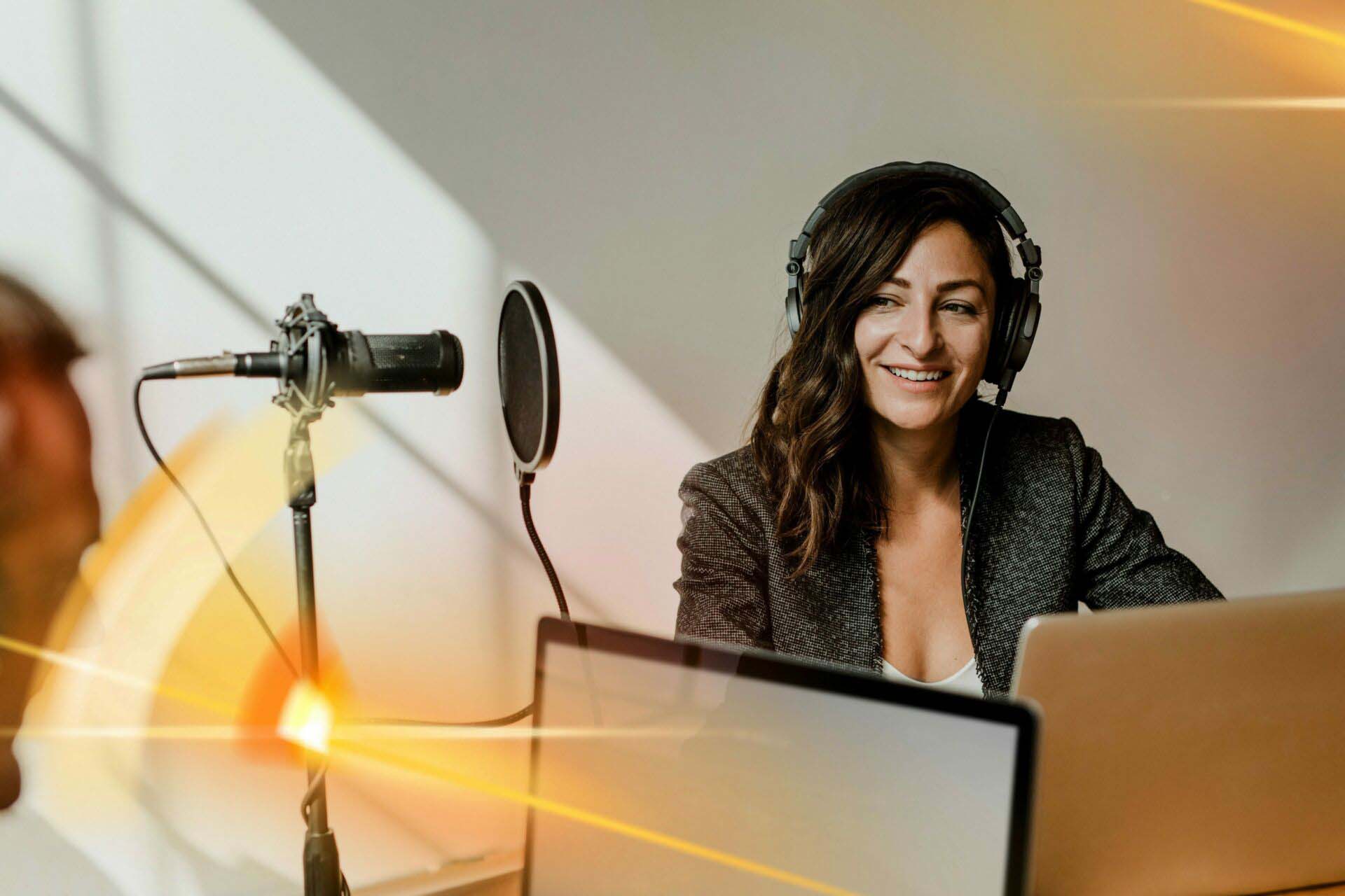 Female broadcaster interviewing her guest in a studio Insurance for Broadcasters